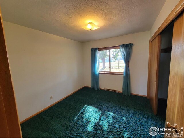 unfurnished bedroom with carpet flooring and a closet