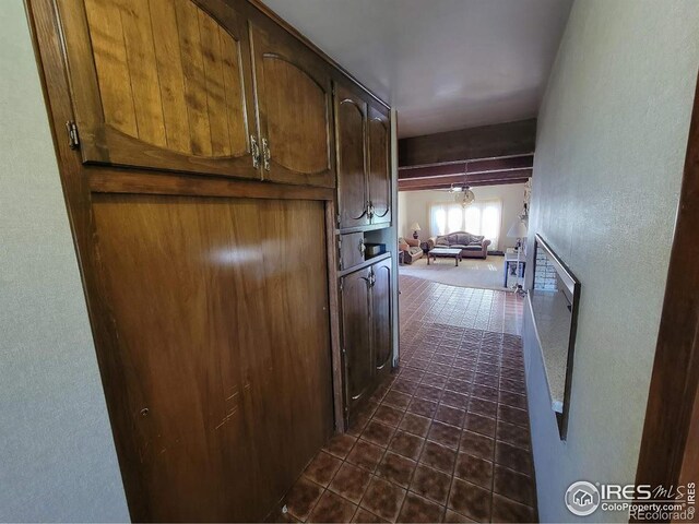 corridor with dark tile patterned floors