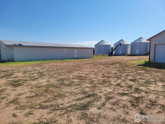 view of yard with a garage