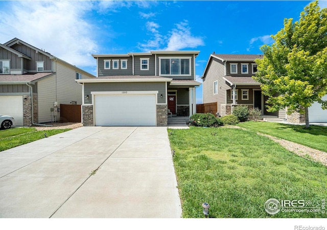 view of front of home with a front lawn and a garage