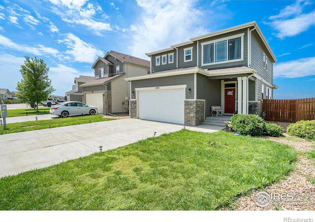 view of front of house featuring a garage and a front lawn