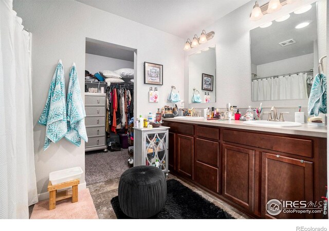 bathroom featuring double vanity