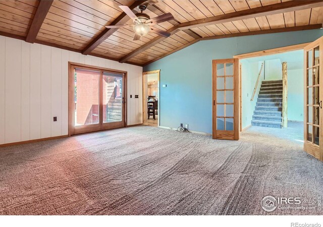 unfurnished living room featuring french doors, lofted ceiling with beams, carpet, and wooden ceiling