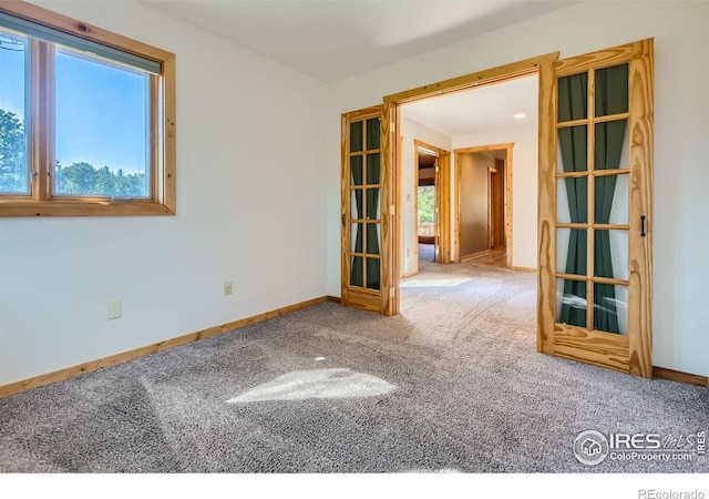 empty room featuring carpet flooring