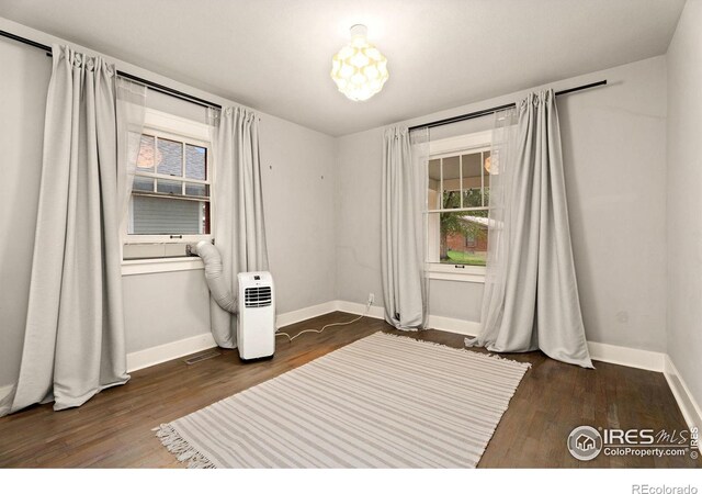 spare room with dark hardwood / wood-style flooring