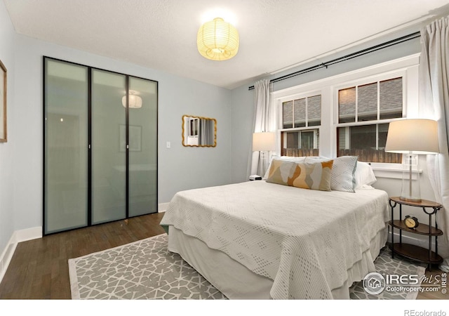 bedroom featuring dark hardwood / wood-style flooring