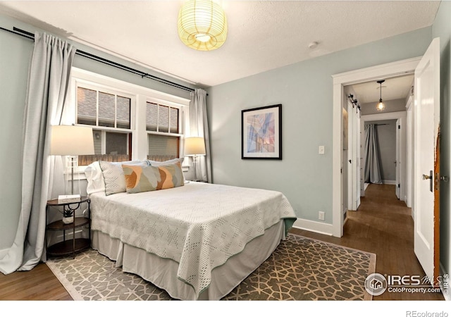 bedroom featuring wood-type flooring