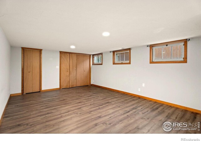 spare room featuring wood-type flooring