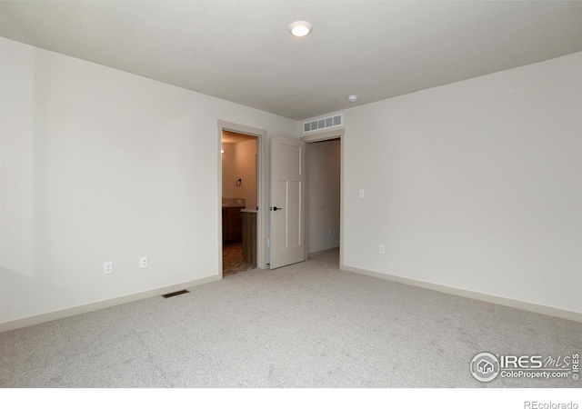 view of carpeted spare room