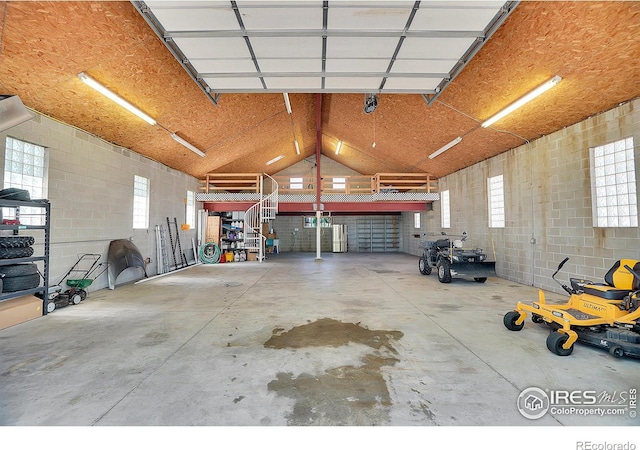 garage with concrete block wall