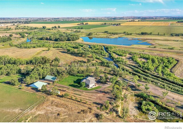 drone / aerial view featuring a water view and a rural view