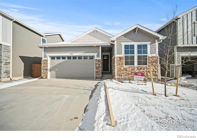 craftsman-style house with driveway and an attached garage