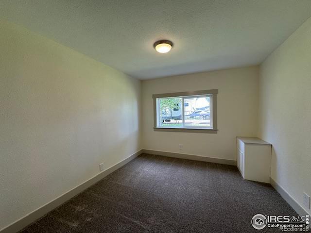 unfurnished room featuring carpet