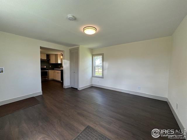 unfurnished living room with dark hardwood / wood-style floors