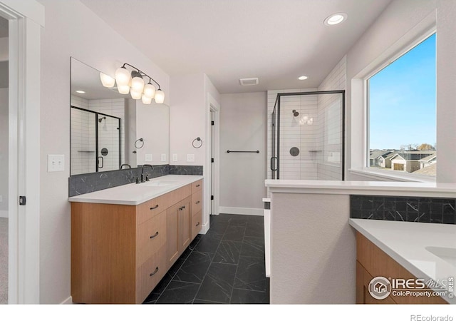 3288 Buffalo Grass Ln, Wellington, CO 80549 - full bathroom featuring marble finish flooring, vanity, a stall shower, and recessed lighting