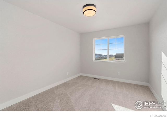 empty room featuring carpet floors