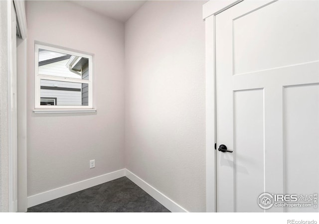 3288 Buffalo Grass Ln, Wellington, CO 80549 - spare room with baseboards and dark colored carpet