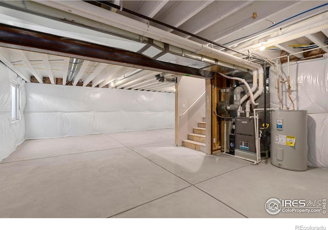 basement featuring heating unit and water heater