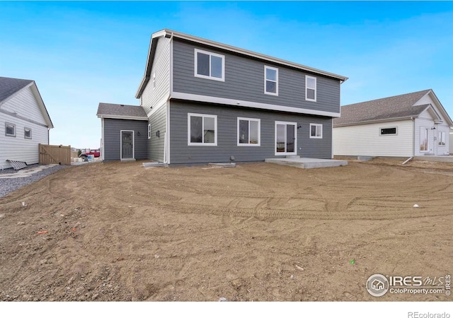 back of property with a patio area