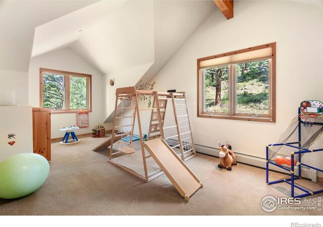 playroom with vaulted ceiling and carpet flooring