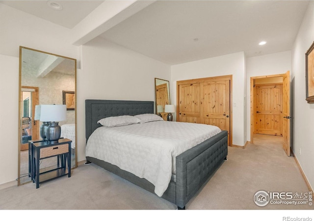 bedroom with recessed lighting, a closet, light carpet, and baseboards