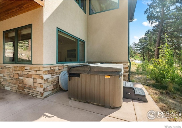 view of patio with a hot tub