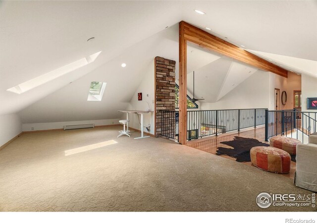 bonus room featuring ceiling fan, carpet, lofted ceiling with skylight, and brick wall