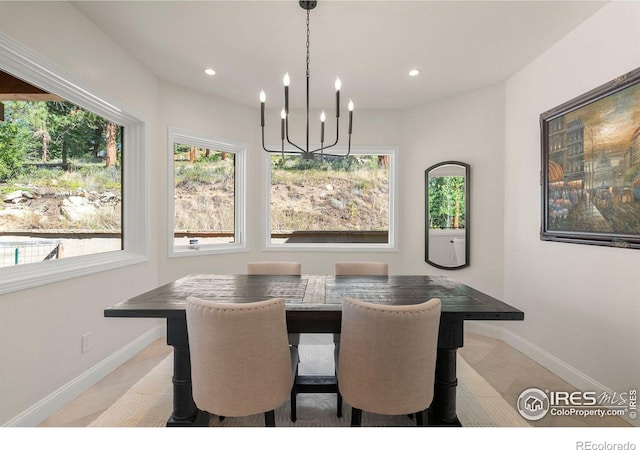 tiled dining space with a notable chandelier