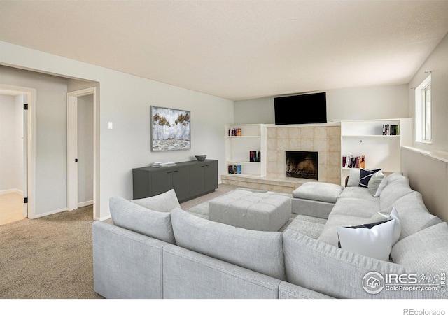 living room featuring light carpet, a fireplace, and baseboards