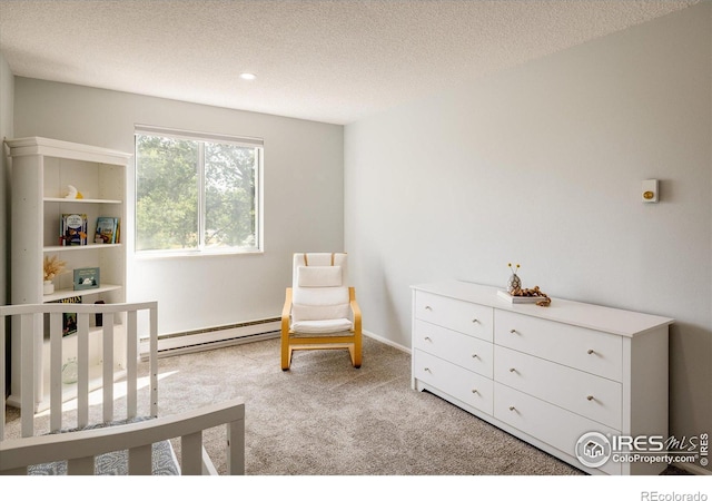 bedroom featuring a textured ceiling, a baseboard radiator, and light colored carpet