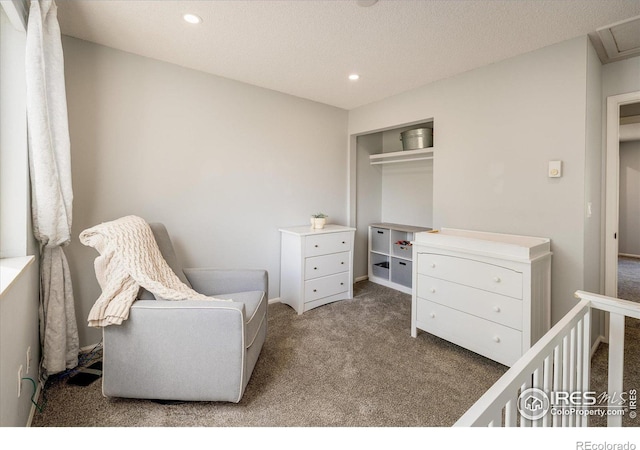 carpeted bedroom featuring a textured ceiling, a closet, and recessed lighting