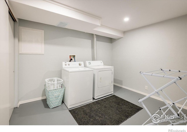 clothes washing area with recessed lighting, laundry area, washer and clothes dryer, and baseboards