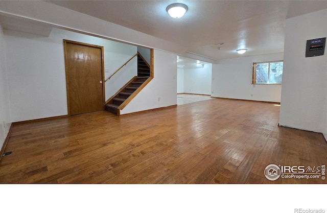 2720 E 121st Pl, Thornton, CO 80241 - below grade area featuring baseboards, stairs, and hardwood / wood-style flooring