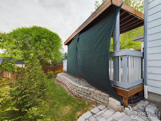 2720 E 121st Pl, Thornton, CO 80241 - view of property exterior with a wooden deck and fence