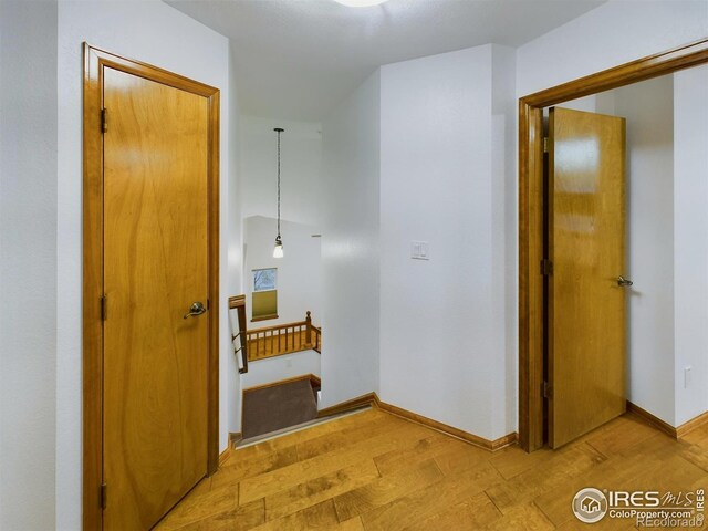 2720 E 121st Pl, Thornton, CO 80241 - hall featuring light wood finished floors and baseboards