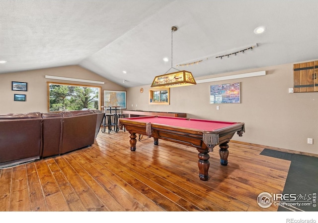 game room featuring billiards, a textured ceiling, light hardwood / wood-style floors, and lofted ceiling