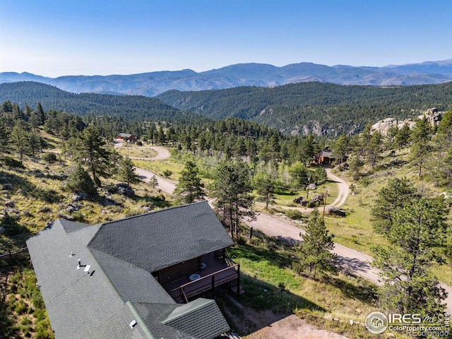 birds eye view of property featuring a mountain view