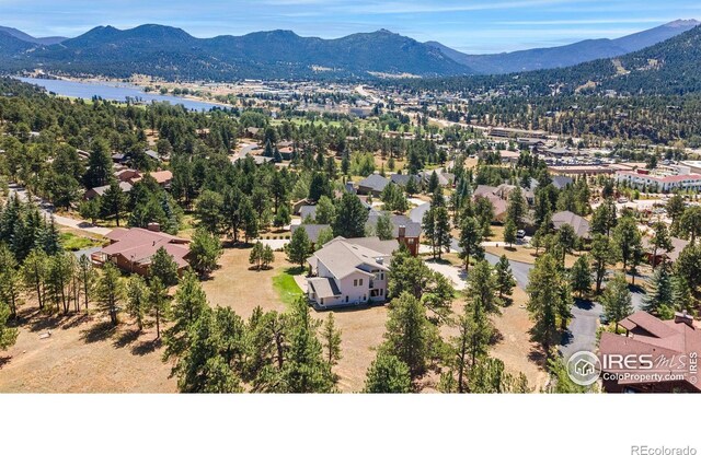 birds eye view of property with a mountain view