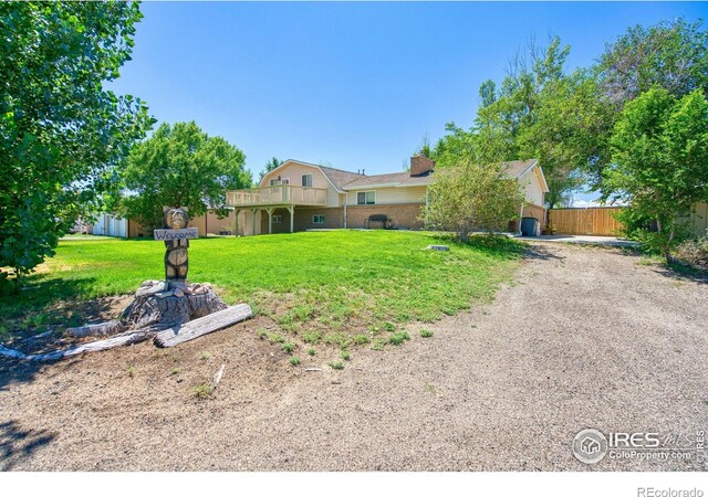 ranch-style home featuring a front yard