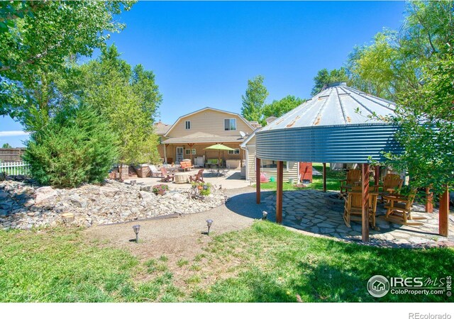 view of yard with a gazebo and a patio