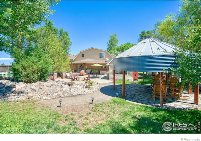 view of yard featuring a patio and a gazebo