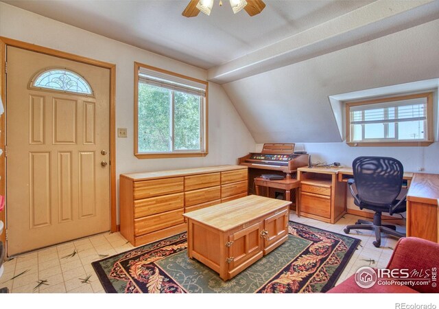 tiled office featuring ceiling fan and lofted ceiling