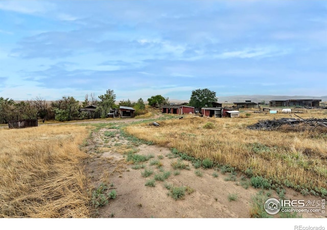 view of yard with a rural view