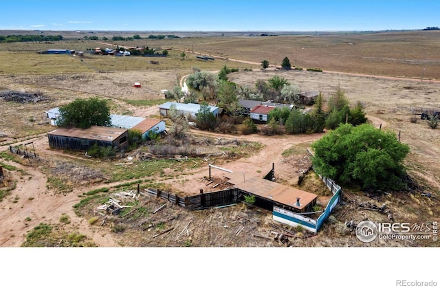 birds eye view of property with a rural view