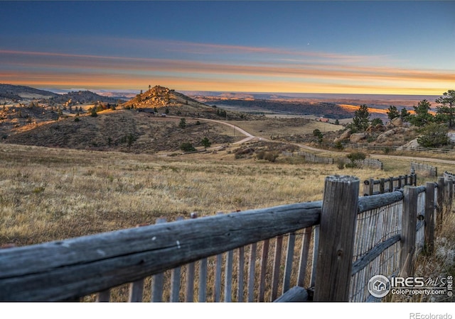 mountain view featuring a rural view