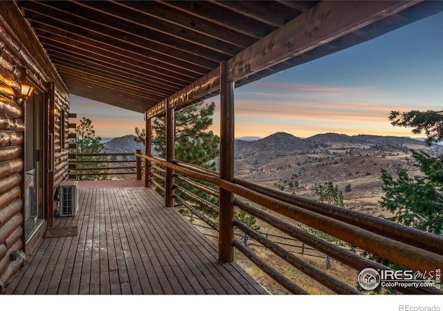 wooden deck featuring a mountain view