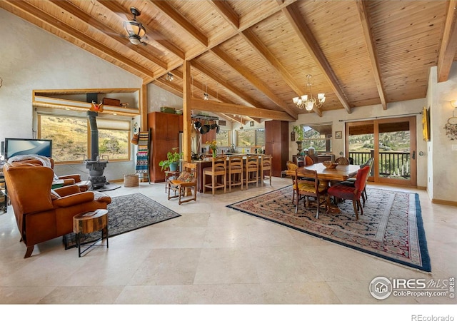 dining space with a wealth of natural light, light tile patterned floors, and beamed ceiling