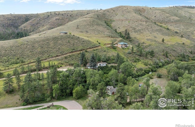 birds eye view of property featuring a mountain view