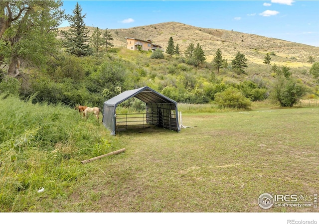 mountain view featuring a rural view