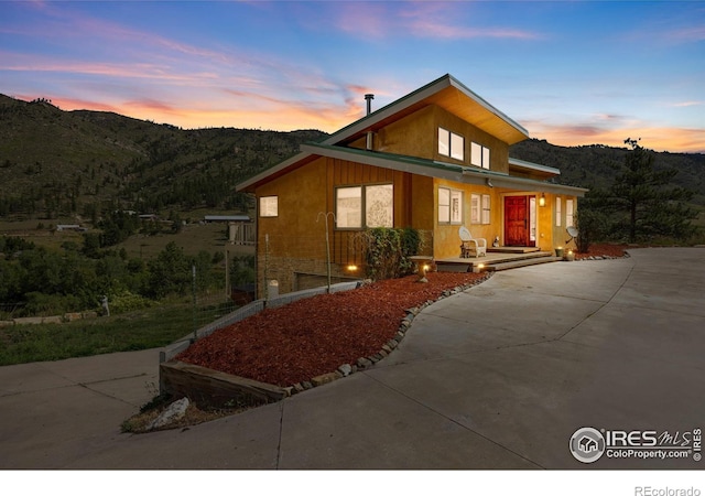 view of front facade featuring a mountain view